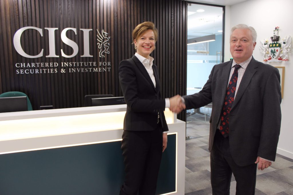 Marge Tooming-Pullisaar (Chief Executive of BFAA) and Kevin Moore (CISI Global Business Development Director) signing an agreement